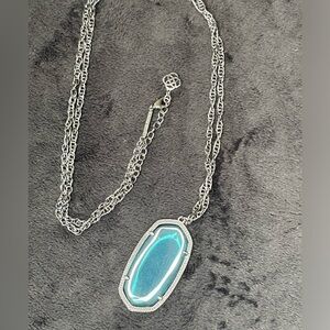 Kendra Scott gunmetal and blue iridescent crystal long necklace.